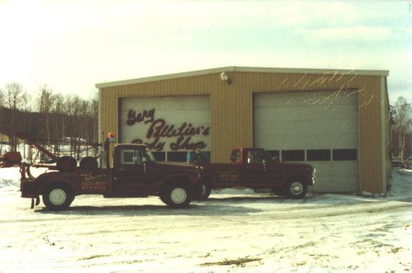 exterior of Pelletier's Body shop with truck in 1977